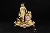 AN ANTIQUE FRENCH GILT BRASS CLOCK BY R&C PARIS AND LONDON