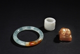 A SHOUSHAN STONE SEAL, A JADEITE BANGLE, AND A WHITE JADE ARCHER'S THUMB RING