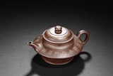 A YIXING PURPLE CLAY GILT DECORATED TEAPOT
