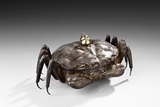 A SILVER AND METAL 'CRAB' CONTAINER WITH LID