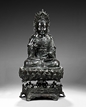 A MAGNIFICENT BRONZE FIGURE OF GUANYIN ON LOTUS STAND