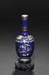 A BLUE-GROUND AND GILT DECORATED VASE