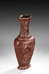 A CARVED CINNABAR LACQUER VASE
