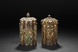 A PAIR OF SILVER FILIGREE AND ORNATED BOXES WITH COVERS