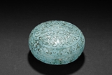 A TURQUOISE ROUND SEAL PASTE BOX WITH COVER