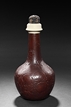 A CARVED GOURD BOTTLE VASE WITH IVORY AND TORTOISE SHELL LID