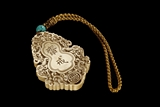 AN IVORY CARVED 'ZHAIJIE' PENDANT
