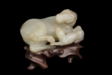 A WHITE JADE CARVED MODEL OF TWO HORSES