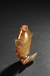 AN AGATE CARVED 'JUMPING CARP' SNUFF BOTTLE