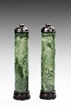 A PAIR OF OPENWORK SPINACH JADE SMOKE CYLINDERS