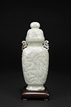 A WHITE JADE 'LANDSCAPE' VASE WITH COVER