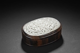 A RETICULATED WHITE JADE INSET OVAL COVERED WOODEN BOX
