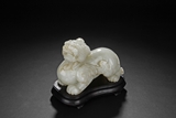A WHITE JADE CARVED MODEL OF BIXIE