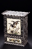 A SILVER CABINET EMBELLISHED WITH IVORY AND MOTHER-OF-PEARL