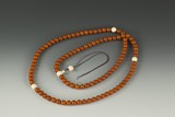 A STRAND OF AMBER AND IVORY 108 BEADS PRAYER BEADS