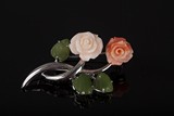 A CORAL FLOWER AND JADE LEAVES WITH WHITE GOLD BROOCH