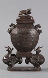 A BRONZE DECORATED COVERDED VESSEL