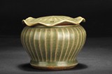 A MELON SHAPED GREEN GLAZED JAR WITH COVER