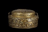 A CARVED BRONZE BOX WITH COVER