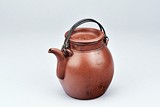 SHI DABIN: A YIXING RED RED CLAY TEAPOT WITH HANDLES