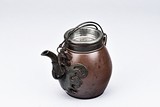 RONG JI: A YIXING RED CLAY TEAPOT WITH HANDLES