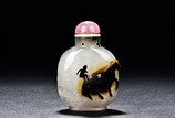 A CLEVELY CARVED AGATE 'MONKEY ATOP HORSE' SNUFF BOTTLE