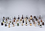 A GROUP OF VINTAGE SMALL WINE/LIQUOR BOTTLES 