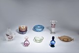 A SET OF EIGHT GLASS CONTAINERS 
