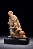 A SOAPSTONE CARVED FIGURAL GROUP