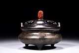 A BRONZE XUANDE TRIPOD CENSER AND COVER