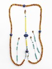 A CARVED AMBER AND LAPIS LAZULI COURT NECKLACE