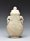 A WHITE JADE CARVED 'PINE AND CRANE' VASE 