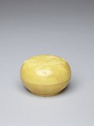 A YELLOW GLAZED PASTE BOX AND COVER
