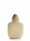 A WHITE JADE CARVED SNUFF BOTTLE WITH SKIN