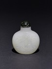 A WHITE JADE 'MYTHICAL BEAST' SNUFF BOTTLE