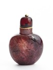 A TOURMALINE CARVED SNUFF BOTTLE