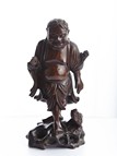 A ROSEWOOD CARVED FIGURE OF LIUHAI 
