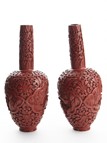 A PAIR OF CINNABAR LACQUER 'FIGURES' VASES