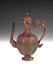 A BRONZE WINE FLAGON STYLED AFTER WESTERN DESIGN