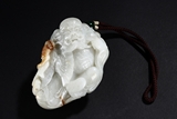 A WHITE JADE CARVED ZHONG KUI ORNAMENT