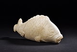 A MARBLE CARVED FISH