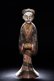 A PAINTED POTTERY FIGURE