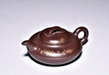 A YIXING COMPRESSED GILT-PAINTED TEAPOT