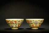 A PAIR OF FAMILLE ROSE YELLOW GLAZED 'SHOU' BOWLS