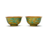 A PAIR OF YELLOW GROUND GREEN GLAZED 'DRAGON' BOWLS