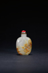 A WHITE JADE 'FIGURE' SNUFF BOTTLE WITH SKIN