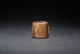AN AGARWOOD 'GOLD' ARCHER'S RING