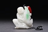 A JADEITE PENDANT OF BOY AND FISH