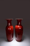 A PAIR OF RED GLAZED VASES