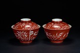 A PAIR OF CORAL RED RESERVE-DECORATED BOWLS